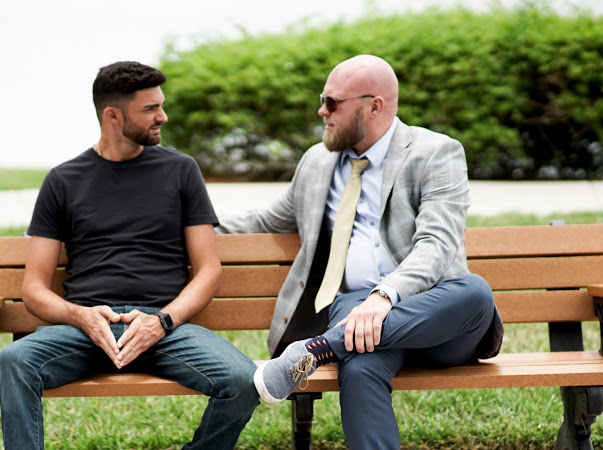 two sober men on a bench