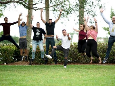 a group of happy sober people jumping